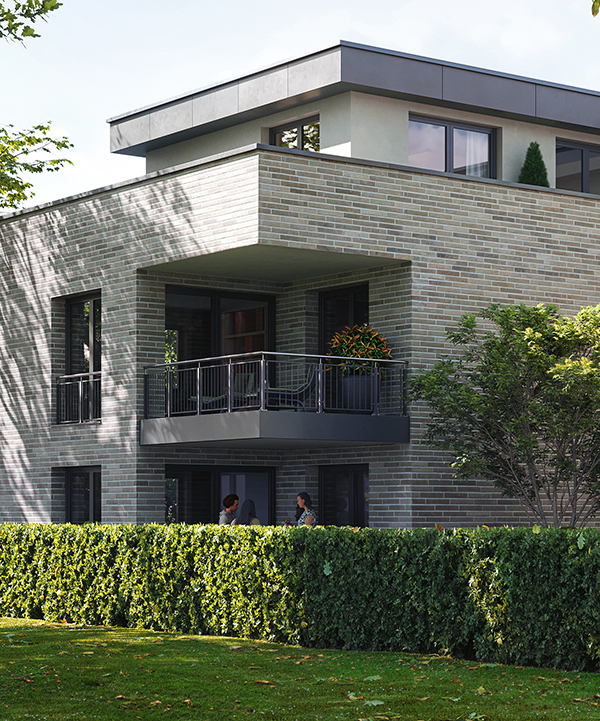 Modernes Wohngebäude des AVENIA Quartiers mit Balkonen und Grünflächen