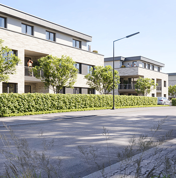 Straßenansicht eines Wohngebäudes im AVENIA Quartier mit Bäumen und Gehweg